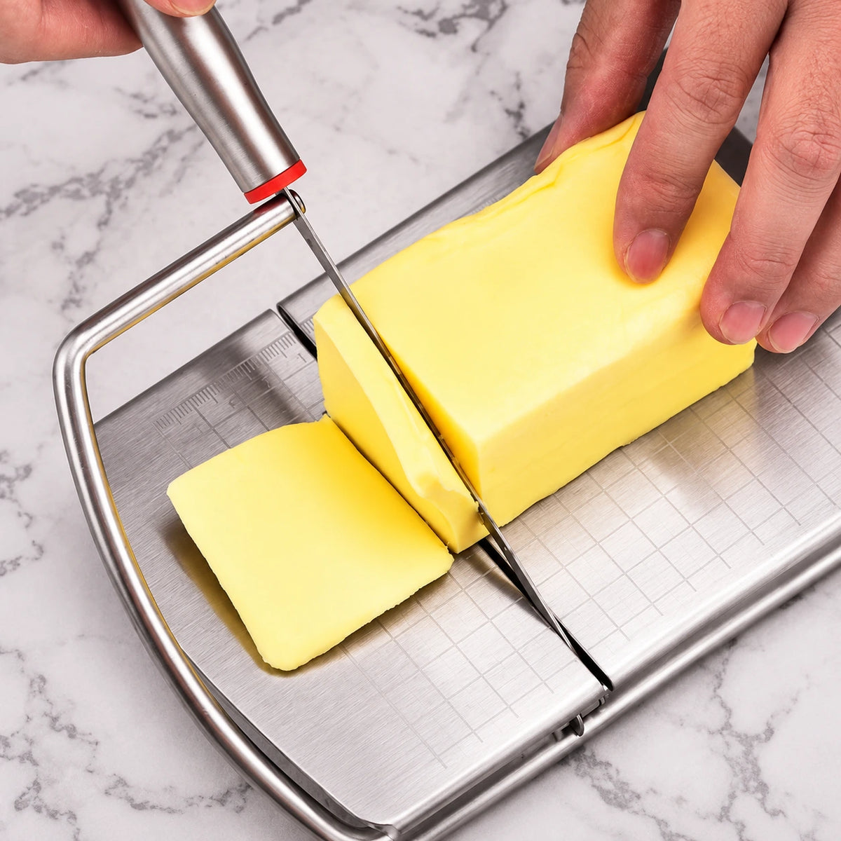 Cheese positioned under the hinged blade with hands clear of the cutting path