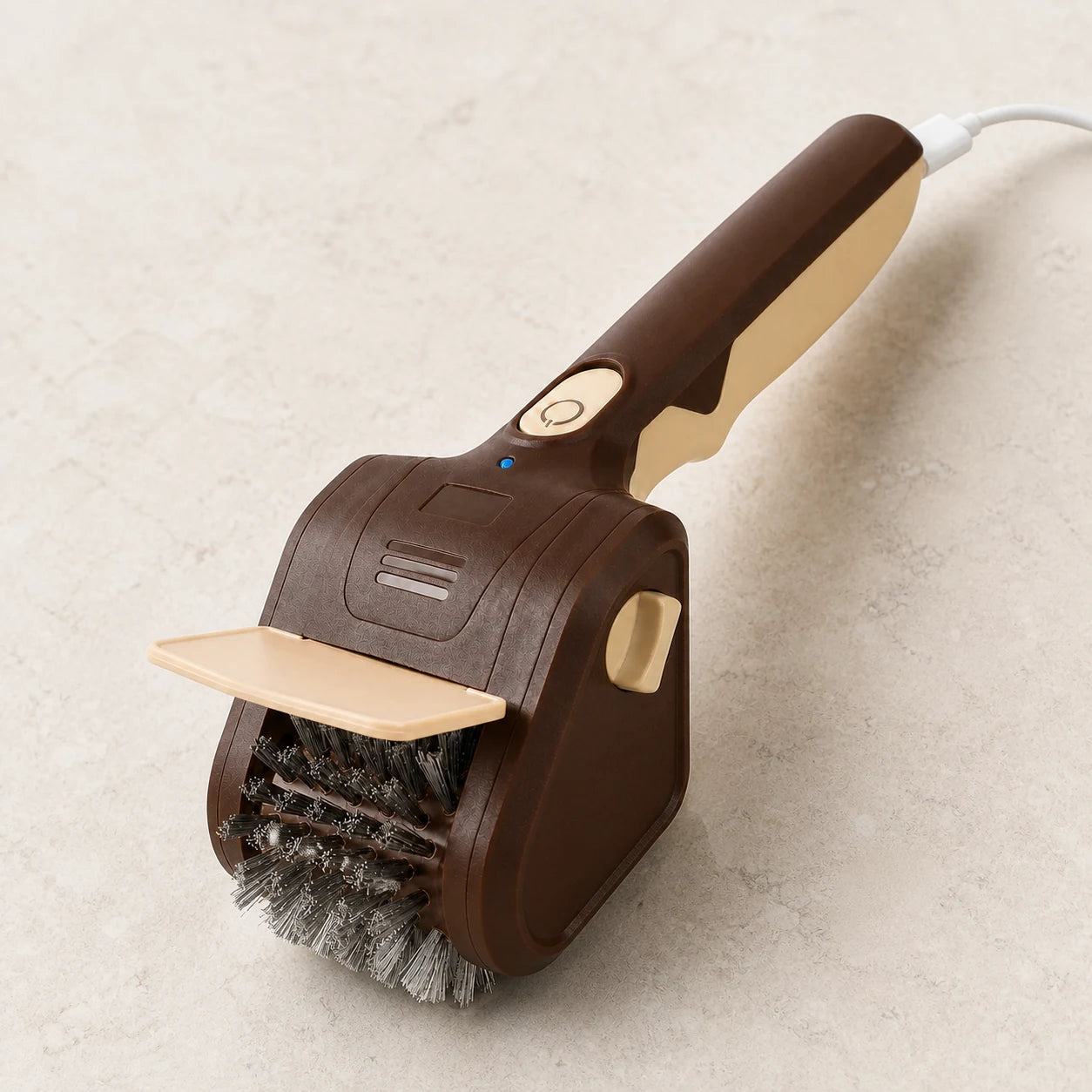 WAFORA electric grill brush connected to USB-C with the blue charging indicator lit.