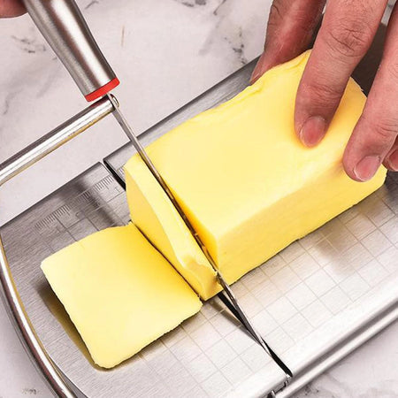 Original close-up photograph showing the real flat blade, marked board and cheese cutting mechanism