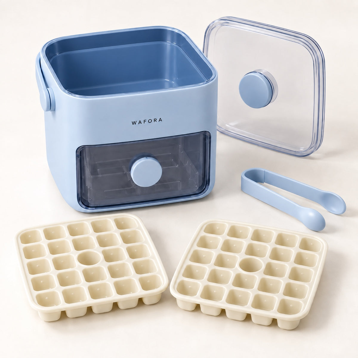 Two cream IcePress trays with 24 cube positions each beside the holder, lid and tongs