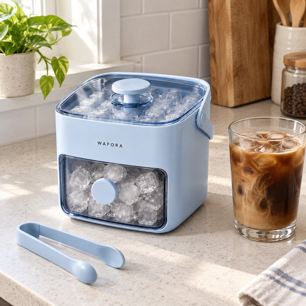 Illustrative WAFORA IcePress kitchen-counter scene with iced coffee and serving tongs