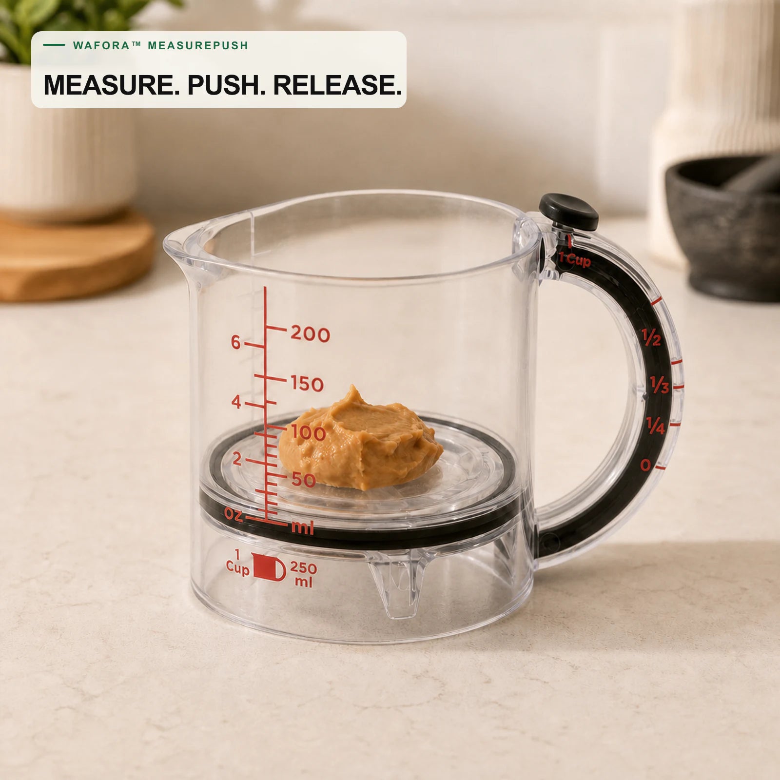 WAFORA MeasurePush adjustable measuring cup with the movable base raising peanut butter toward the rim